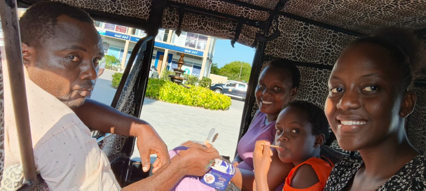 Family enjoying ice cream inside Mose's tuk tuk in Watamu town